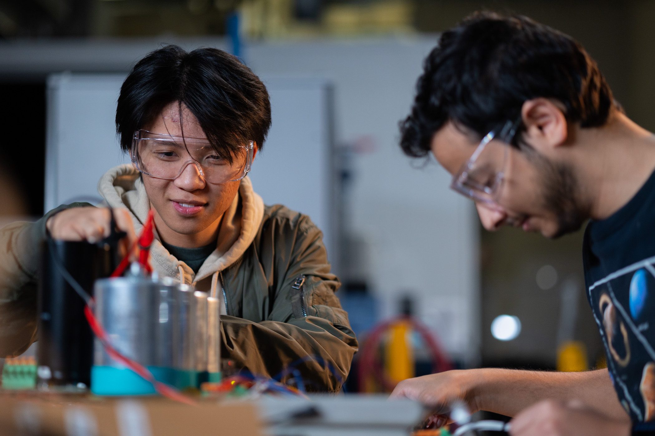 Two students working at table